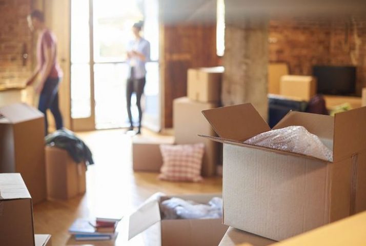 Couple moving in a hurry to their new apartment